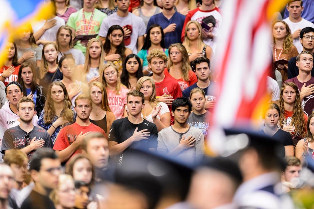 First-year students stand at attention for the singing of the national anthem at the start of the Chancellor's Convocation on Sept. 2.