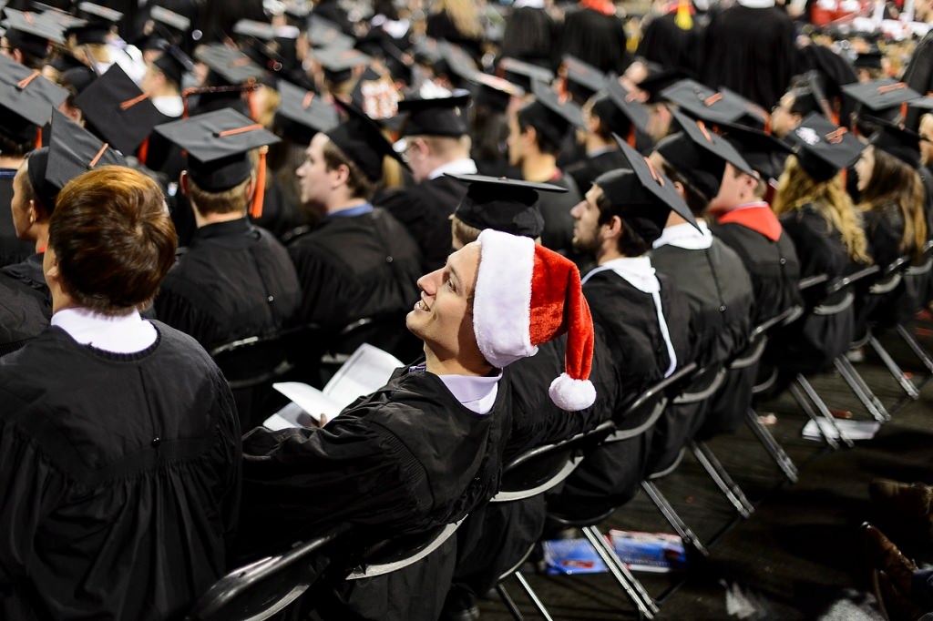 A graduate wearing a Santa hat adds a pop of color to the winter commencement in 2015. This year's winter commencement is Dec. 18.