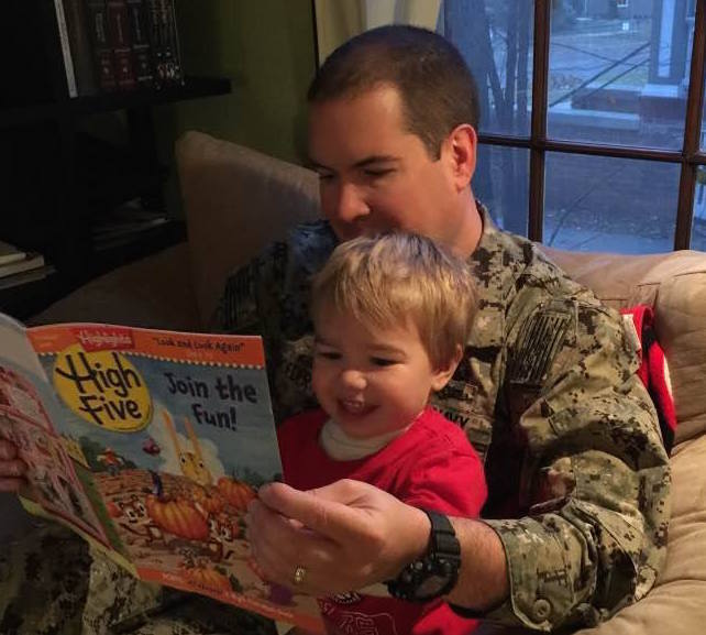 Photo: Dave Schroeder reading to son Nathaniel