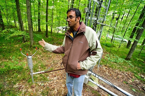 Photo: Ankur Desai stands in front of Willow Creek flux tower