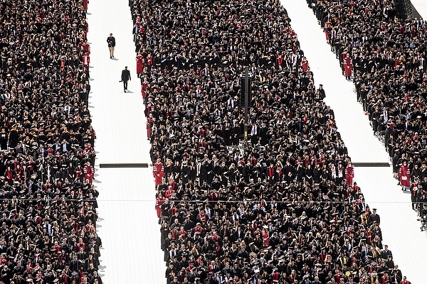 Photo: Shot from above of seated graduates