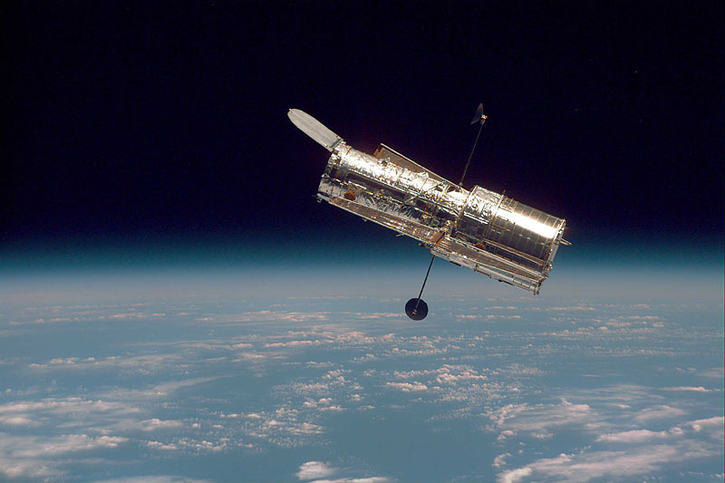 Photo: Hubble Space Telescope hovering over Earth