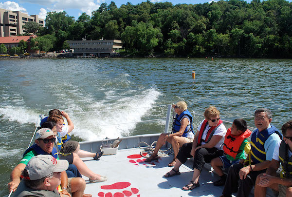 Photo: People riding in boat on Lake Mendota