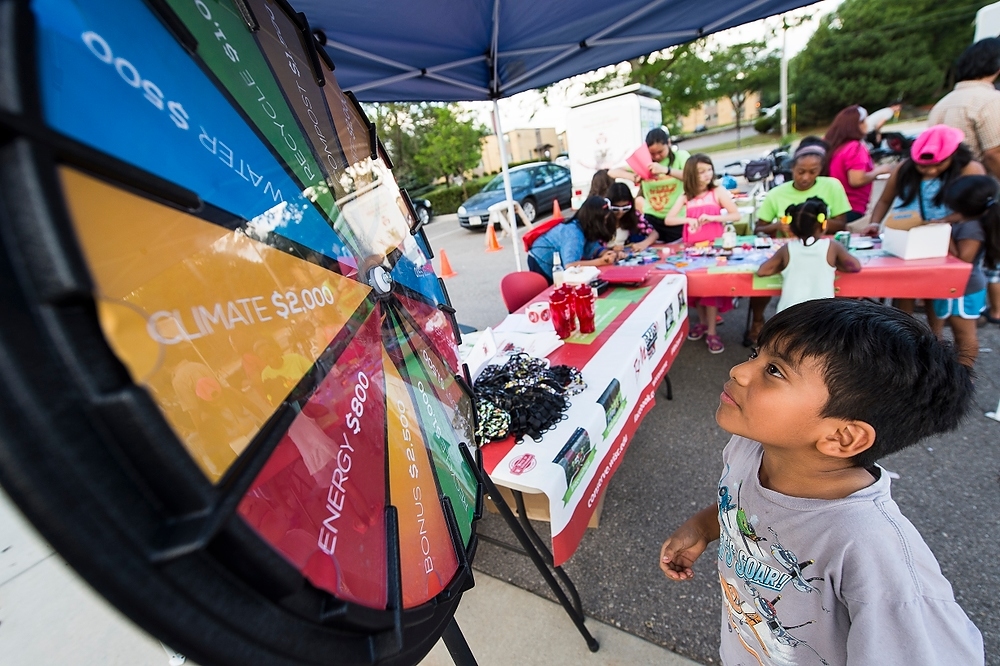 Photo: A child plays a conservation quiz game sponsored by UW–Madison’s We Conserve program.