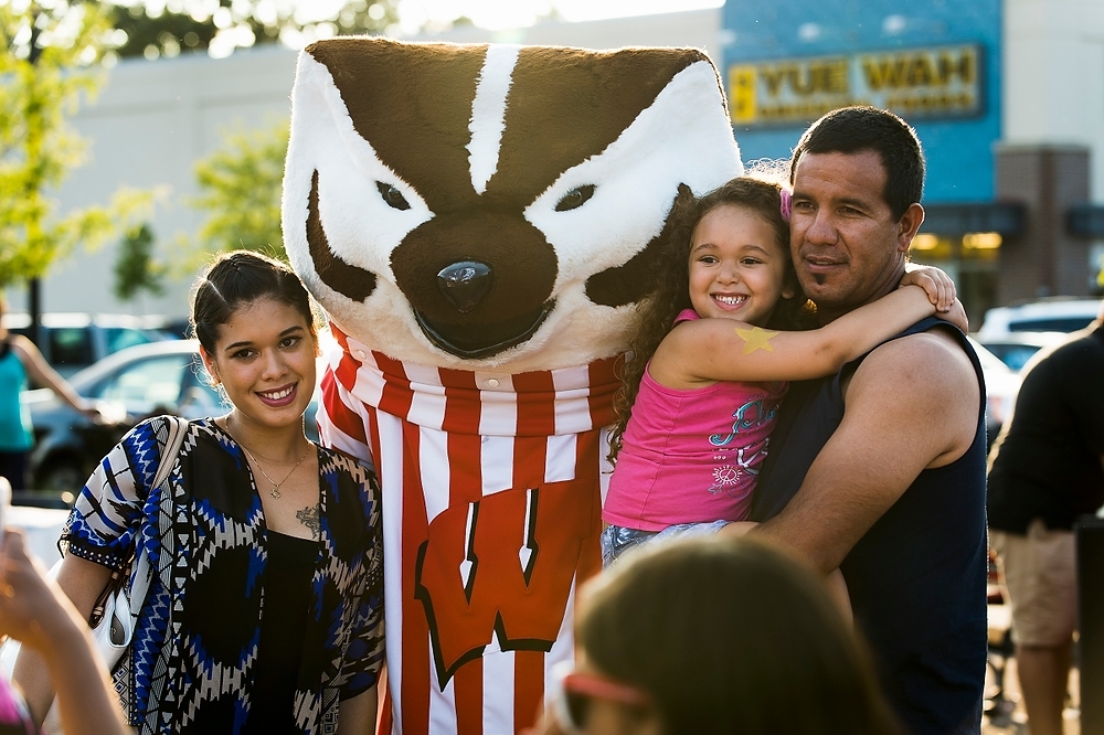 Photo: UW–Madison mascot Bucky Badger visits with families