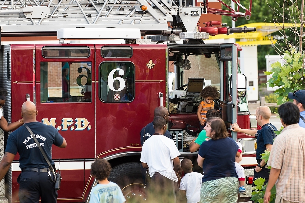 Photo: Firefighters with the Madison Fire Department interact with children and show off their ladder truck 