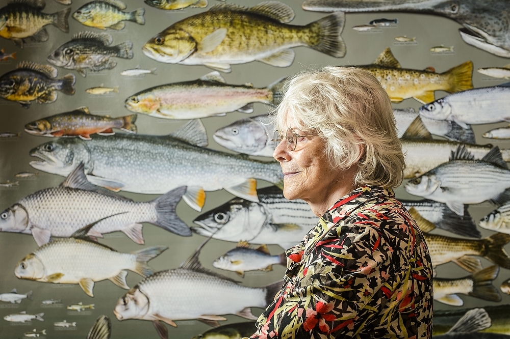 Photo: Kandis Elliot in front of fish poster