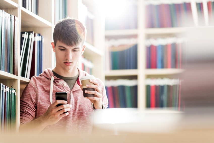 Photo: Concerned student looking at phone