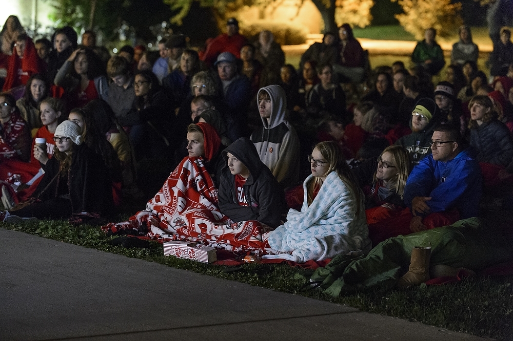 Photo: People watching movie outside Dejope Residence Hall