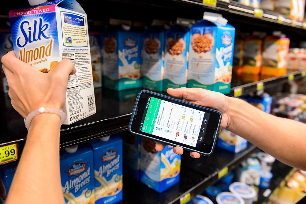 Photo: Person using smartphone to scan food item