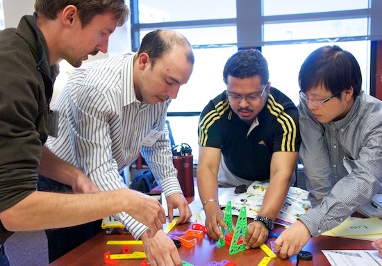 Photo: students building toy tower