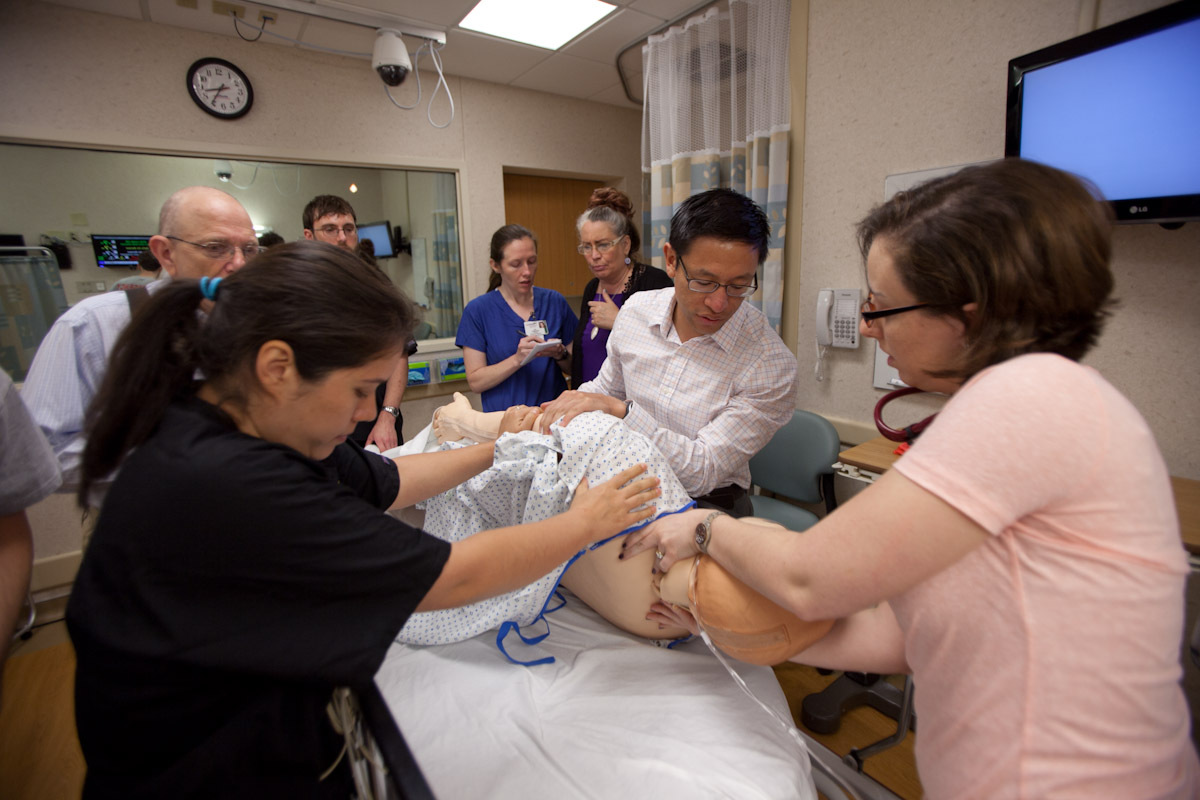 Medical residents working on simulated patient