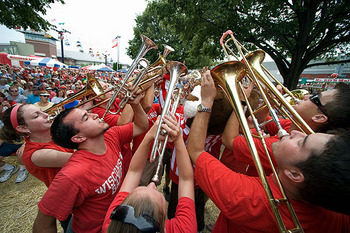 Photo: marching band members playing instruments