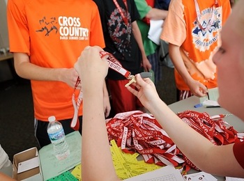 Photo: student receiving lanyard