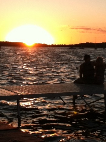 Photo: couple sitting on Union Terrace at sunset
