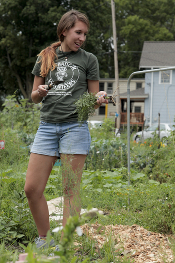 Photo: volunteer weeding garden