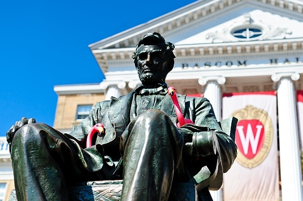 Photo: plastic pink flamingos on Lincoln statue