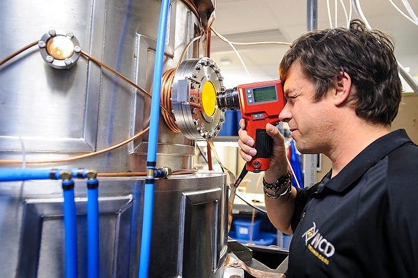 Photo: Patrick Heaney checking a vacuum chamber