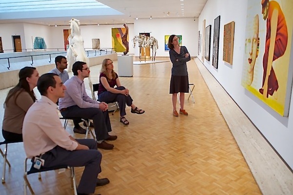 Photo: medical residents looking at painting in art museum