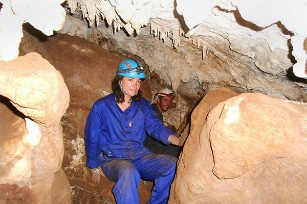 Photo: Alia Gurtov at cave opening
