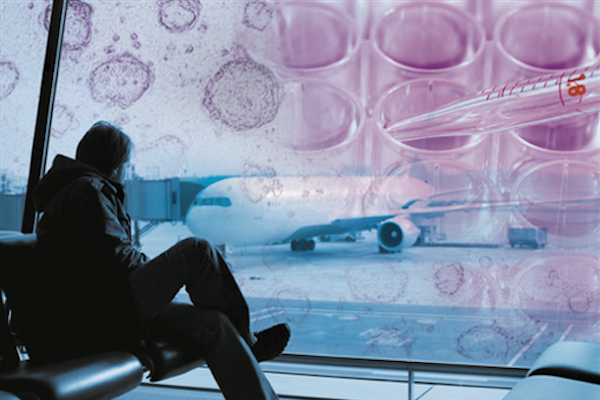 Photo illustration: stem cells superimposed over man sitting in airport
