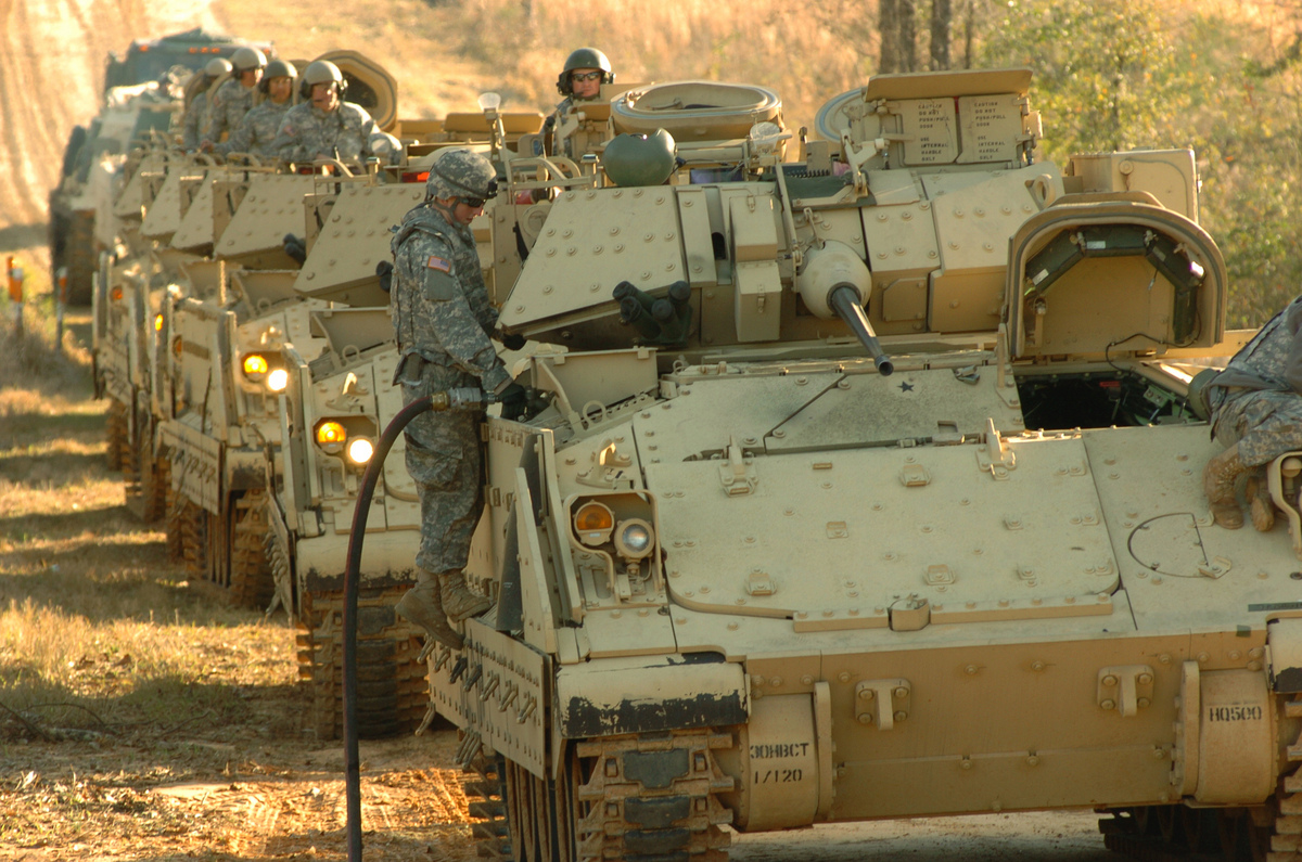 Photo: soldier fueling fighting vehicle