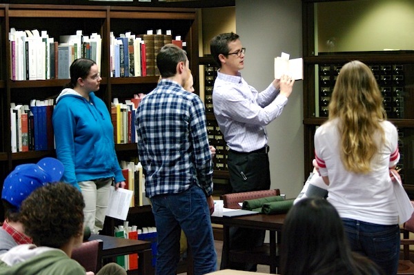 Student displays a rare book