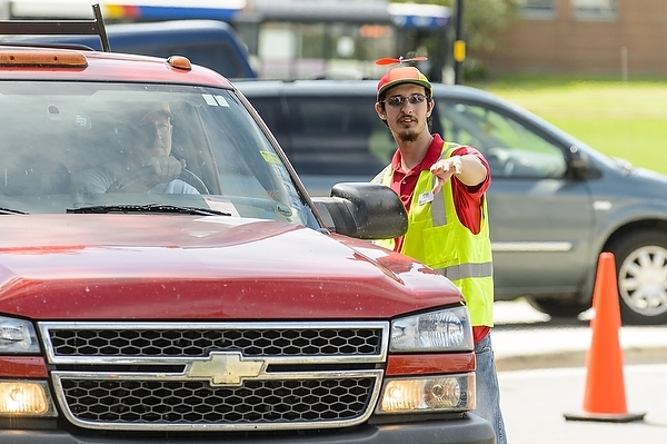 Photo: volunteer directing traffic