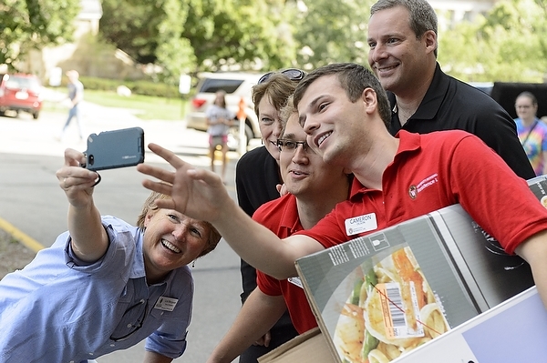 Photo: university staff posing for selfie