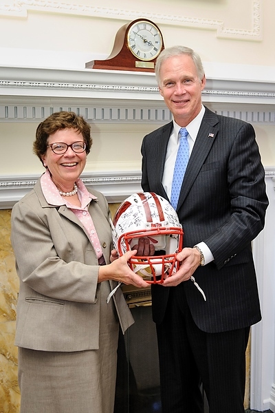 Photo: Chancellor Blank presents autographed helmet to Sen. Ron Johnson