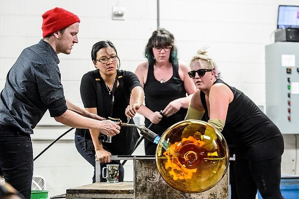 Photo: Mad Gaffers inflating a glass ornament