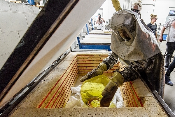 Photo: John Hallett loading a class ornament into a kiln