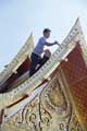 Small photo of painter on Thai Pavilion roof