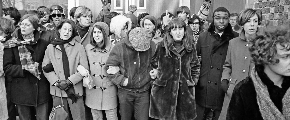 Students stand arm in arm blocking entrances to university buildings in support of the strike. Photo by John Wolf