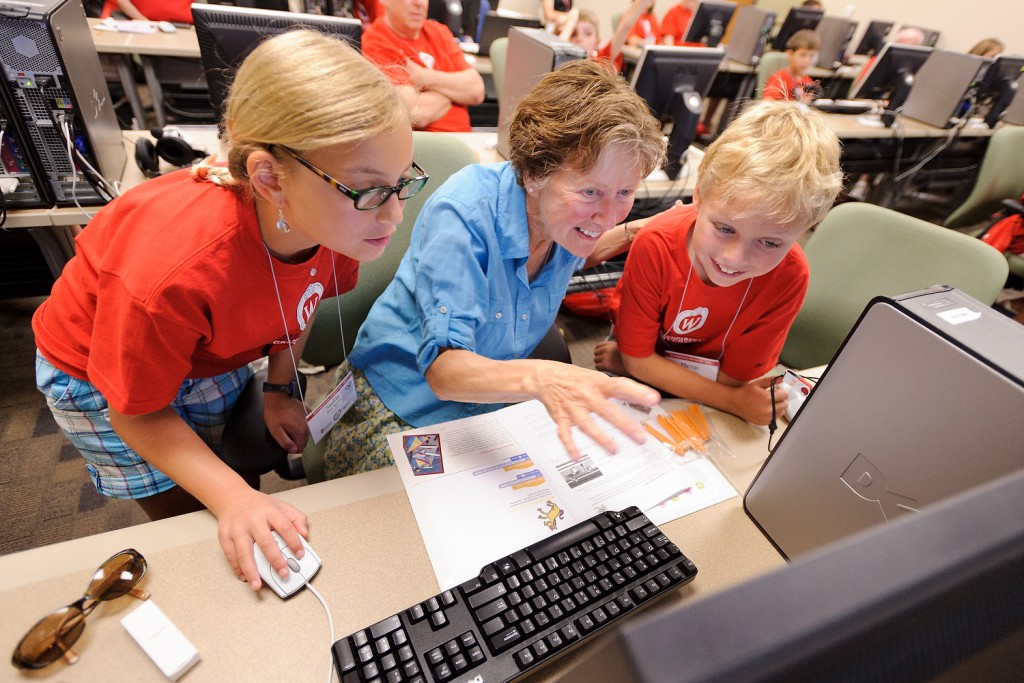Sally Bilder and her grandchildren, Saskia and Martijn den Boon, program an interactive computer game during a Grandparents University class. The nearly 1,300 participants could choose among 22 diverse "majors" to explore together during one of three, two-day sessions.