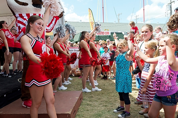 Children try out their dance moves as they watch members of the UW Spirit Squad during the afternoon pep rally.