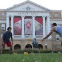 Players gather for a Spikeball game in front of Bascom Hall.