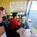 Crew members of the University of Wisconsin-Madison Lifesaving Station Haley Perrin (left) and Steven Read (right) keep watch over Lake Mendota from the Lifesaving Station lookout tower in June 2012.