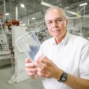 Tom Mohs, founder of plastics manufacturing company Placon, holds a plastic container produced in the Madison factory. Mohs is an alumnus of the University of Wisconsin-Madison, where he studied under UW professor Ron Daggett, who taught the world’s first engineering plastics class in 1946.