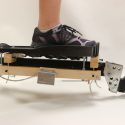 A coordination-retraining device invented by Kreg Gruben was awarded first-round funding from the university’s Discovery to Product program. One key step to commercialization will be to test the device with stroke patients with varying levels of disability. Photo by Kreg Gruben