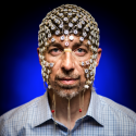Electrical and computer engineering Professor Barry Van Veen wears an electrode net used to monitor brain activity via EEG signals. His research could help untangle what happens in the brain during sleep and dreaming. Photo: Nick Berard