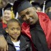 Former UW football player LaMar Campbell with his son, Jayden, at his graduation Dec. 21. Campbell is among the student-athletes who left the university without a degree and returned later to complete one. Photo: Rick Marolt