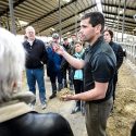 Mike Peters, herd manager in the Department of Dairy Science at UW-Madison, talks about cow feed during a tour at the UW Emmons Blaine Dairy Cattle Research Center in Arlington, Wisconsin during the 2014 Wisconsin Idea Seminar.