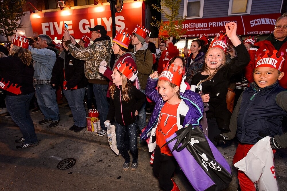 Young Badgers were among the most enthusiastic spectators as the parade floats and performers made their way toward campus.