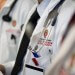 An embroidered W crest is pictured on a medical student’s white coat during floor rounds on the Neurocritical Intensive Care Unit at UW Hospital and Clinics at the University of Wisconsin-Madison on Aug. 18, 2015. (Photo by Jeff Miller/UW-Madison)