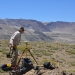 Basil Tikoff, professor of geoscience at UW-Madison, uses a precise GPS instrument to record shoreline altitude at Laguna del Maule. 