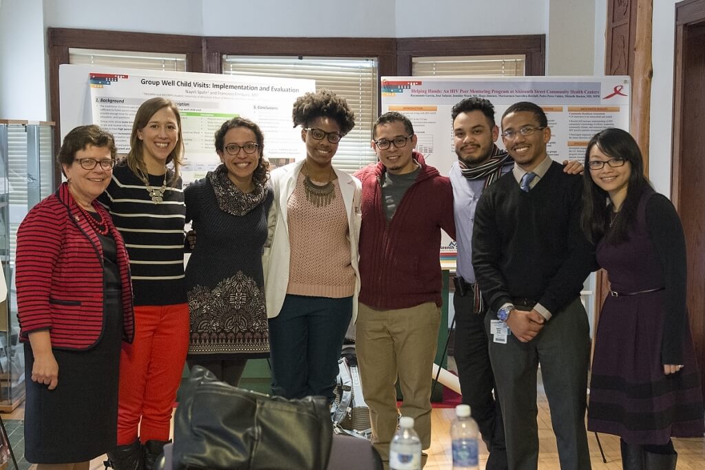 During an outreach trip to Milwaukee, UW–Madison Chancellor Rebecca Blank (left) is pictured with UW medical students working with the Training in Urban Medicine and Public Health (TRIUMPH) program at the Walnut Way Conservation Corporation in Milwaukee.