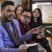UW medical student Ray Garcia (left) talks about his work on an HIV peer mentoring program at the Sixteenth Street Community Health Center.