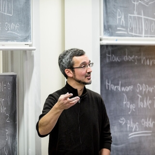Remzi Arpaci-Dusseau, professor in the Department of Computer Science, teaches his Comp Sci 537 Intro to Operating Systems class in Ingraham Hall at the University of Wisconsin-Madison on Feb. 4, 2016. Arpaci-Dusseau is one of twelve 2016 Distinguished Teaching Award recipients. (Photo by Bryce Richter / UW-Madison)