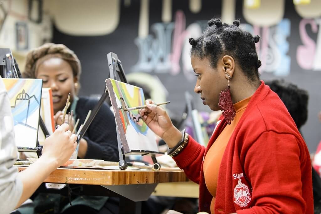 UW student Ashley Thomas takes part in the Body Positivity and Black Sexuality Paint Night workshop event held in collaboration with the Delta Sigma Theta Sorority at Wheelhouse Studios at the Memorial Union  on Feb. 20. The event featured painting instruction by Ashley Robertson. 